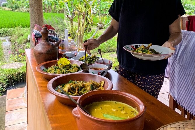 Balinese Vegan Cooking Class with Fresh Harvesting & Garden Tour - Picking ingredients from the organic garden