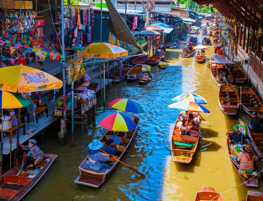 Bangkok: Private Floating & Railway Markets with Farm Visits - Taking a long-tail boat through Damnoen Saduak