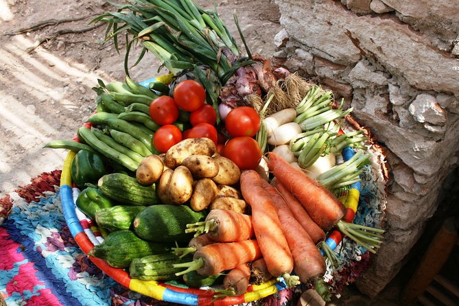 Berber Cooking Class at a Farm in the Countryside & shopping at a rural Souk. - Roasting barley and grinding it in a stone mill
