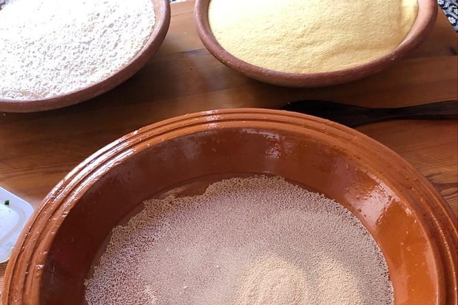 Berber Cooking Class at a Farm in the Countryside & shopping at a rural Souk. - Baking flat bread in a clay oven
