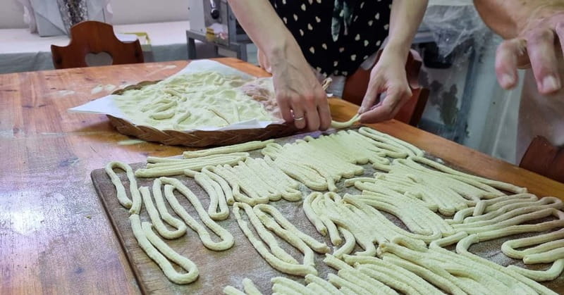 From Alghero: Farm to Table cooking experience in Montresta - Walking through Montresta after lunch