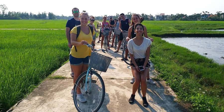 Hoi An: Countryside Bicycle Tour with Farm, Basket Boat Ride - Cycling Through Rice Fields and Working Farms