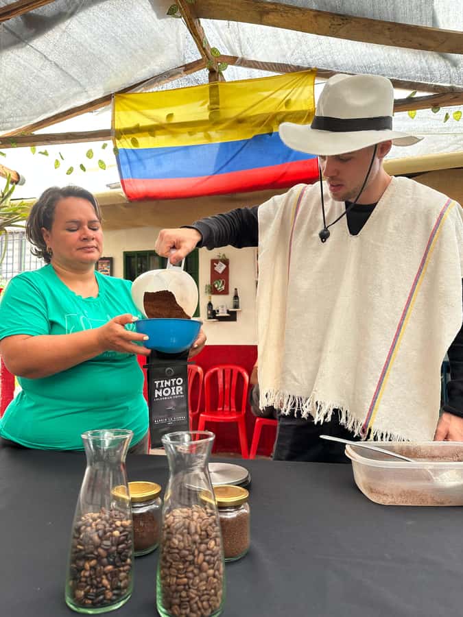 Medellín Coffee Farm Tour with Trolley and Cable Car Ride - Picking coffee berries by hand