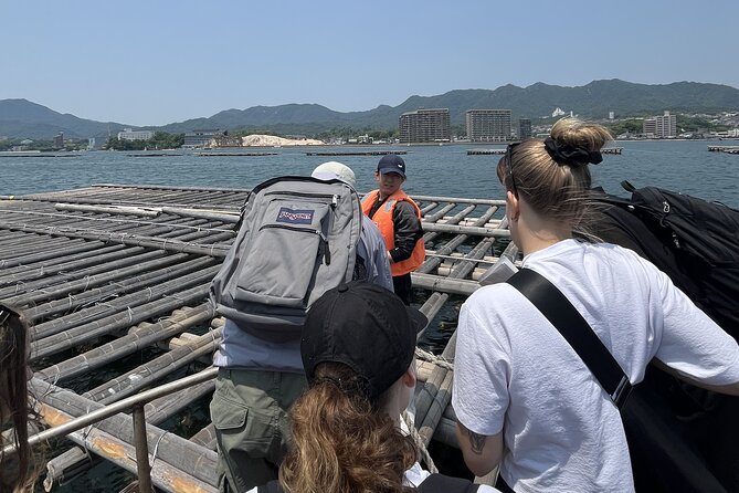 Miyajima Guided Tour and Fresh Oyster Farm Tour - Itsukushima Shrine and the meaning behind the torii