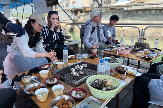 Miyajima Guided Tour and Fresh Oyster Farm Tour - Grilling oysters at Shimada Suisan