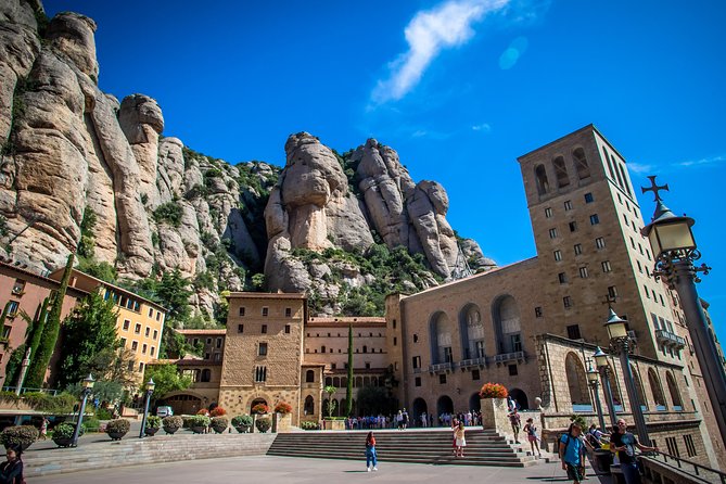 Montserrat & Winery Visit Tour with Traditional Farmhouse Lunch - Leaving Barcelona beside the Palau de la Música