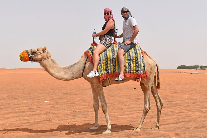 "Morning Desert Safari with Camel Farm visits & Arabic Treats" - Sandboarding with ten to fifteen minutes on the dune