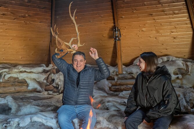 Reindeer Farm Experience in Summer and Autumn from Rovaniemi - Feeding the reindeer during the first visit