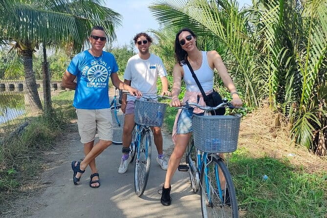 Small Group Bicycle Tour with Farming and Fishing Experience - Paddling a round basket boat through the palms