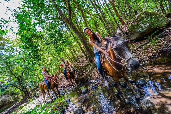Vida Aventura Ranch Experience - Horseback riding through hills, streams, and cattle country