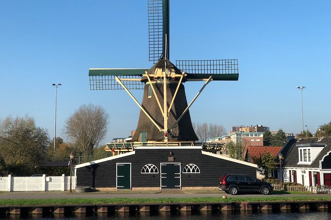 Windmill, Dairy Farms & Countryside Electric Bike Tour - Returning through Amsterdam Noord